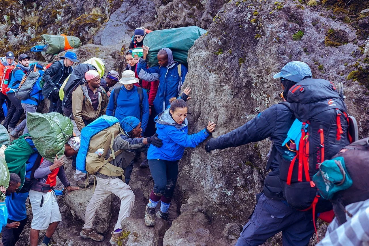 Machame Route Kilimanjaro climbing trail with trekkers hiking toward Uhuru Peak