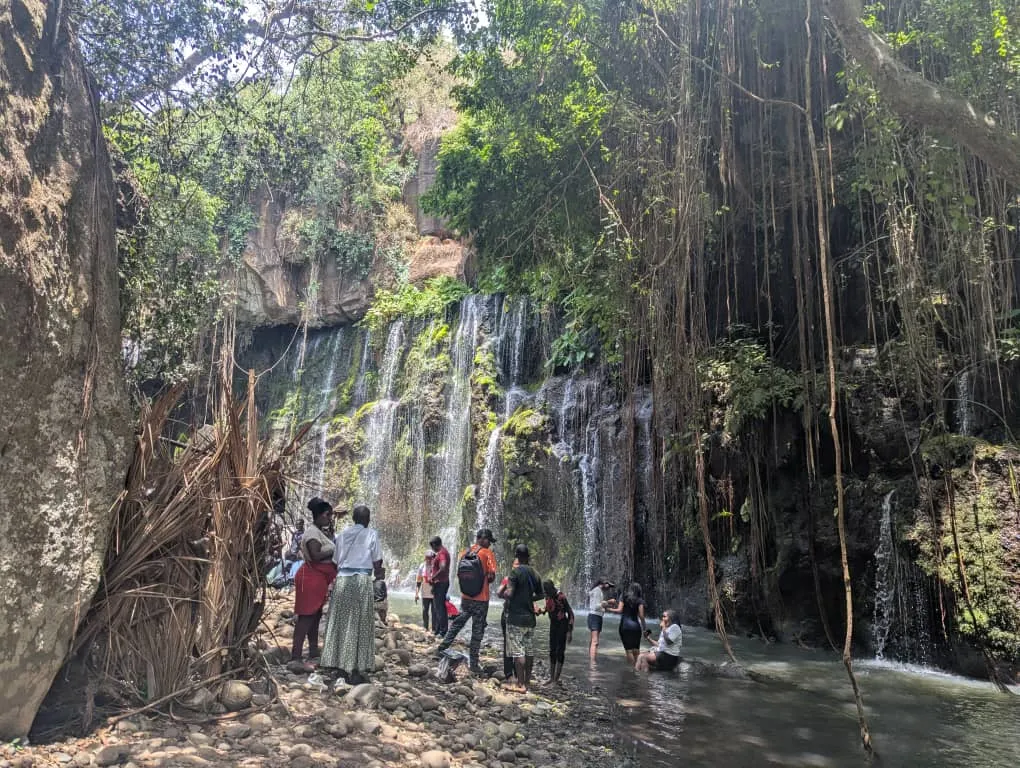 Mailisita Waterfall cascading through lush tropical vegetation in the Kilimanjaro foothills near Moshi, Tanzania