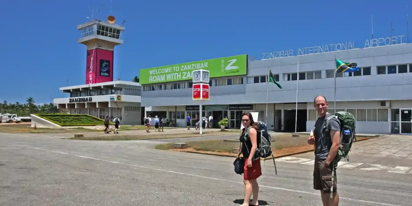 Zanzibar International Airport terminal with planes and passengers